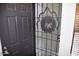 Dark gray front door with decorative metal security door and holiday wreath at 4201 N 20Th St # 205, Phoenix, AZ 85016