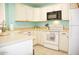 Bright kitchen with white cabinets and modern appliances at 4201 N 20Th St # 205, Phoenix, AZ 85016