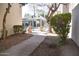 Pathway to pool area with landscaping and trees at 4201 N 20Th St # 205, Phoenix, AZ 85016