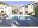 Community pool with surrounding lounge chairs at 4201 N 20Th St # 205, Phoenix, AZ 85016