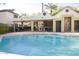 Community pool with surrounding patio and grilling station at 4201 N 20Th St # 205, Phoenix, AZ 85016