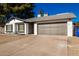 Updated single story home with gray garage door and nicely landscaped front at 4316 E La Puente Ave, Phoenix, AZ 85044