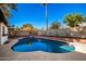 Inviting kidney-shaped pool with brick coping and a large backyard at 4316 E La Puente Ave, Phoenix, AZ 85044