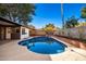 Inviting kidney-shaped pool with brick coping and a spacious patio area at 4316 E La Puente Ave, Phoenix, AZ 85044