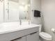 Modern bathroom with gray vanity and walk-in shower at 4415 N Sidney St, Buckeye, AZ 85396