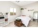 Cozy bedroom with full-size bed and built-in shelving at 4415 N Sidney St, Buckeye, AZ 85396