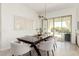 Modern dining room with dark wood table and chairs at 4415 N Sidney St, Buckeye, AZ 85396