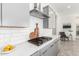 Gas cooktop and white subway tile backsplash in kitchen at 4415 N Sidney St, Buckeye, AZ 85396