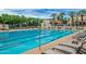 Community lap pool with lounge chairs at 4415 N Sidney St, Buckeye, AZ 85396