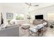 Light and airy living room with sectional sofa and chairs at 4415 N Sidney St, Buckeye, AZ 85396