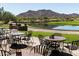 Outdoor patio with seating overlooking a pond and golf course at 4415 N Sidney St, Buckeye, AZ 85396