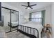 Serene bedroom with a metal bed frame and mirrored closet at 4525 N 66Th St # 34, Scottsdale, AZ 85251