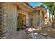 Brick facade with double wooden doors and brick steps at 4525 N 66Th St # 34, Scottsdale, AZ 85251