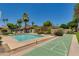 Community pool with shuffleboard and lounge chairs at 4525 N 66Th St # 34, Scottsdale, AZ 85251