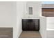 Elegant bathroom vanity with dark wood cabinets, white countertops, and modern fixtures at 4727 N 177Th Dr, Goodyear, AZ 85395