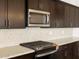 Close-up on the kitchen with modern stainless steel appliances and granite countertops at 4727 N 177Th Dr, Goodyear, AZ 85395