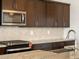 Close-up on the kitchen with modern stainless steel appliances and granite countertops at 4727 N 177Th Dr, Goodyear, AZ 85395