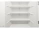 Bright white closet offers ample open shelving for storage and organization at 4727 N 177Th Dr, Goodyear, AZ 85395