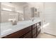 Modern bathroom with double sinks and dark brown vanity at 4806 S 110Th Ave, Tolleson, AZ 85353