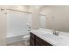 Clean bathroom with tub, toilet and dark vanity at 4806 S 110Th Ave, Tolleson, AZ 85353