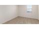 Simple bedroom with tile flooring and a window at 4806 S 110Th Ave, Tolleson, AZ 85353