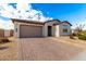 New construction home with a two-car garage and front walkway at 4806 S 110Th Ave, Tolleson, AZ 85353