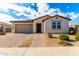 Single-story home with attached garage and landscaped front yard at 4806 S 110Th Ave, Tolleson, AZ 85353