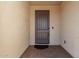 Dark brown front door with a small covered entryway at 4806 S 110Th Ave, Tolleson, AZ 85353