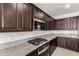 Modern kitchen with granite countertops and stainless steel appliances at 4806 S 110Th Ave, Tolleson, AZ 85353