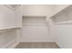 Bright walk-in closet with double hanging rods and shelving at 4806 S 110Th Ave, Tolleson, AZ 85353