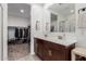 Double vanity bathroom with a walk-in closet and shower at 5644 W Jackalope Ln, Laveen, AZ 85339