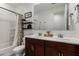 Bathroom with double sinks and a shower/tub combo at 5644 W Jackalope Ln, Laveen, AZ 85339