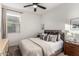 Cozy bedroom with window and wooden nightstands at 5644 W Jackalope Ln, Laveen, AZ 85339