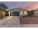 New construction home with two-car garage and landscaped yard at 5644 W Jackalope Ln, Laveen, AZ 85339