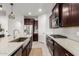 Modern kitchen with a farmhouse sink and stainless steel appliances at 5644 W Jackalope Ln, Laveen, AZ 85339