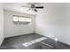 Bright bedroom with ceiling fan and dark tile flooring at 6732 E Culver St, Scottsdale, AZ 85257