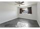 Well-lit bedroom with ceiling fan and dark tile flooring at 6732 E Culver St, Scottsdale, AZ 85257