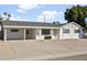 Front view of a white single story home with carport at 6732 E Culver St, Scottsdale, AZ 85257