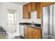 Kitchen with stainless steel appliances and wood cabinets at 6732 E Culver St, Scottsdale, AZ 85257