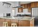 Granite countertop kitchen island with stainless steel appliances at 6732 E Culver St, Scottsdale, AZ 85257