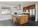 Modern kitchen with granite countertops and wood cabinets at 6732 E Culver St, Scottsdale, AZ 85257