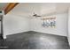 Living room with dark tile floors and ceiling fan at 6732 E Culver St, Scottsdale, AZ 85257