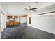 Spacious living area with dark tile flooring and ceiling fan at 6732 E Culver St, Scottsdale, AZ 85257