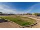 Large grassy area perfect for recreation and relaxation at 6843 W Samantha Way, Laveen, AZ 85339