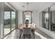 Bright dining room with wood table, gray chairs, and large mirrors at 6843 W Samantha Way, Laveen, AZ 85339