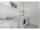 Laundry room with washer, dryer, and utility sink at 6843 W Samantha Way, Laveen, AZ 85339