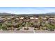 Aerial view of an apartment building complex with palm trees and mountain backdrop at 7117 E Rancho Vista Dr # 4005, Scottsdale, AZ 85251