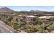 Aerial view of a large apartment complex with lush landscaping and mountain views at 7117 E Rancho Vista Dr # 4005, Scottsdale, AZ 85251