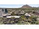 Aerial view of a large apartment complex nestled against a mountain at 7117 E Rancho Vista Dr # 4005, Scottsdale, AZ 85251