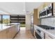 Sleek kitchen featuring stainless steel appliances and light wood cabinets at 7117 E Rancho Vista Dr # 4005, Scottsdale, AZ 85251